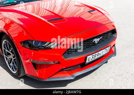 Samara, Russia - May 8, 2022: Front part of Ford Mustang vehicle with car grille and licence plate. Ford brand is a manufacturer of cars in USA Stock Photo