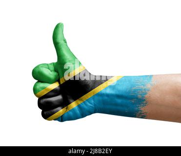 Hand making thumb up painted with flag of tanzania Stock Photo