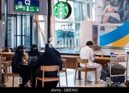 Jeddah, Saudi Arabia. 14th May, 2022. Customers are seen at the American multinational chain Starbucks Coffee store at Jeddah (Yidda) international airport. (Photo by Budrul Chukrut/SOPA Images/Sipa USA) Credit: Sipa USA/Alamy Live News Stock Photo