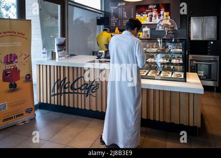 Jeddah, Saudi Arabia. 14th May, 2022. A customer stands at the American multinational fast-food Mcdonald's McCafe order counter in Jeddah. (Photo by Budrul Chukrut/SOPA Images/Sipa USA) Credit: Sipa USA/Alamy Live News Stock Photo