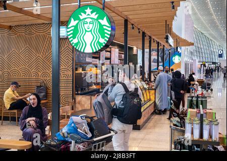 Jeddah, Saudi Arabia. 14th May, 2022. Customers are seen at the American multinational chain Starbucks Coffee store at Jeddah (Yidda) international airport. (Photo by Budrul Chukrut/SOPA Images/Sipa USA) Credit: Sipa USA/Alamy Live News Stock Photo