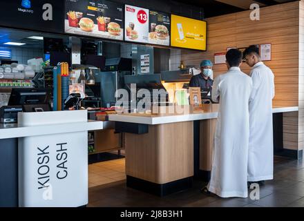 Jeddah, Saudi Arabia. 14th May, 2022. Customers stand at the American multinational fast-food Mcdonald's order counter in Jeddah. (Photo by Budrul Chukrut/SOPA Images/Sipa USA) Credit: Sipa USA/Alamy Live News Stock Photo