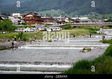 iida, nagano, japan, 2022/15/05 , People fishing during an event at Matsugawa river in Iida city in Nagano, Japan. Stock Photo