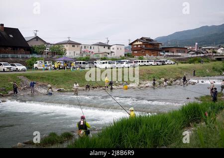 iida, nagano, japan, 2022/15/05 , People fishing during an event at Matsugawa river in Iida city in Nagano, Japan. Stock Photo