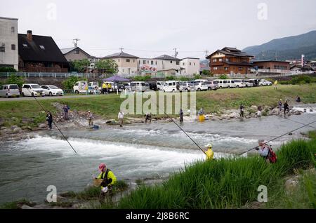 iida, nagano, japan, 2022/15/05 , People fishing during an event at Matsugawa river in Iida city in Nagano, Japan. Stock Photo