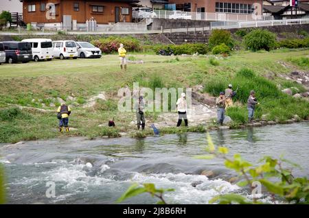 iida, nagano, japan, 2022/15/05 , People fishing during an event at Matsugawa river in Iida city in Nagano, Japan. Stock Photo