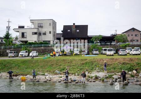 iida, nagano, japan, 2022/15/05 , People fishing during an event at Matsugawa river in Iida city in Nagano, Japan. Stock Photo