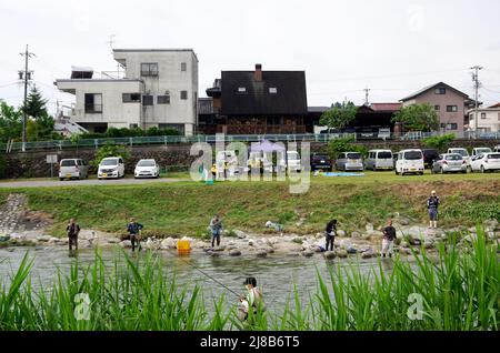 iida, nagano, japan, 2022/15/05 , People fishing during an event at Matsugawa river in Iida city in Nagano, Japan. Stock Photo