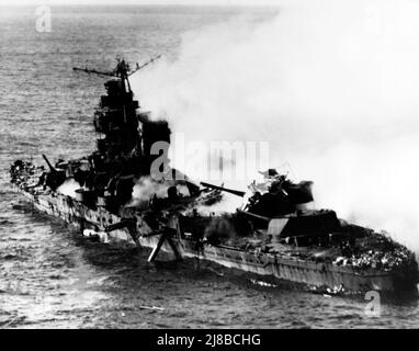 The Japanese heavy cruiser Mikuma, photographed from a USS Enterprise Douglas SBD-3 Dauntless after she had been bombed by planes from Enterprise and USS Hornet. The ship is heavily damaged and sank soon after, Stock Photo