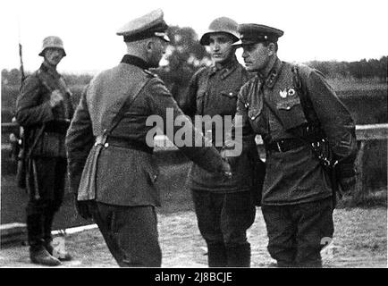 German and Soviet army officers pictured shaking hands After the division of Poland, World War II Stock Photo