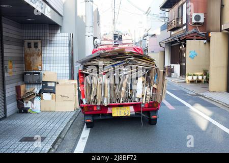 A truck in Kyoto, Japan, collecting cardboard for recycling. Stock Photo
