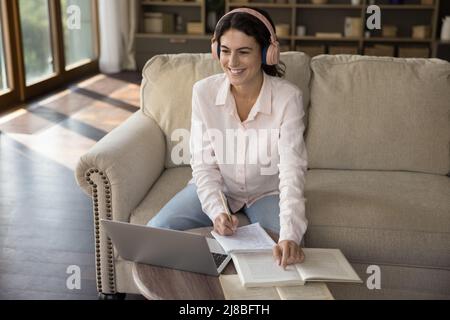 Young student woman studying at home use laptop Stock Photo