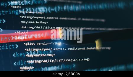 Abstract computer script code. Programming code screen of software developer. Software Programming Work Time. Stock Photo