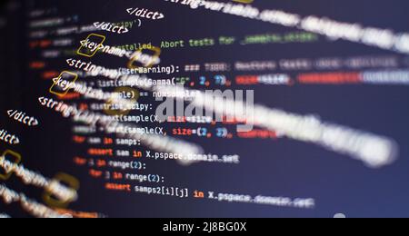 Website HTML Code on the Laptop Display Closeup Photo. Modern tech. Innovative startup project. Stock Photo