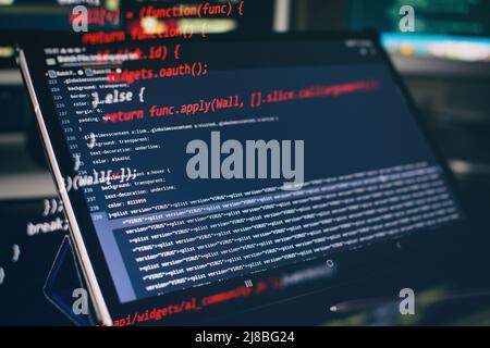 Modern tech. PHP syntax highlighted. Writing programming functions on laptop. Big data and Internet of things trend. Stock Photo