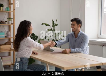Happy young business leader man employing worker Stock Photo