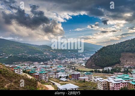 Thimphu, Bhutan - October 26, 2021: Aerial view cityscape of Bhutan capitol city. Top view with dramatic cloudy sky over the town. Largest city in Bhu Stock Photo