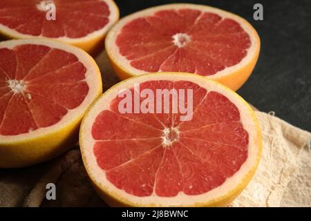 sliced ripe grapefruit on a light cloth Stock Photo