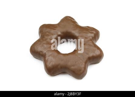 Single star shaped gingerbread biscuit covered in chocolate and isolated on white background Stock Photo