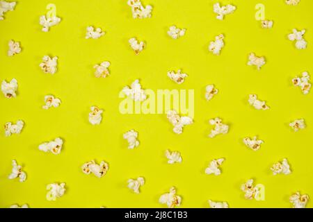 Popcorn on a yellow background, close-up view from above Stock Photo