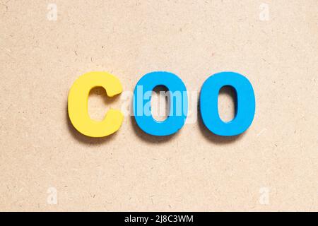 Color alphabet letter in word COO (abbreviation Chief operating officer) on wood background Stock Photo