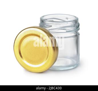 Front view of open empty glass jar and blank golden lid isolated on white Stock Photo