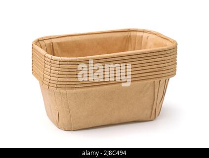 Stack of disposable rectangular brown paper baking molds isolated on white Stock Photo