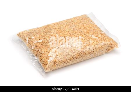 Plastic bag of dried yellow split peas isolated on white Stock Photo