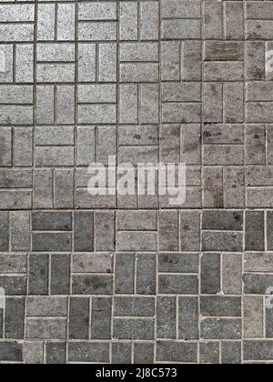 texture background of gray dirty street paving slabs of rectangular shape. Stock Photo