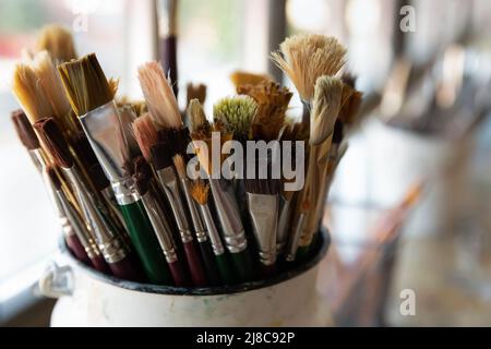 Close up bunch of used and cleaned diverse paintbrushes Stock Photo