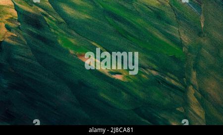 Texture of green paint with glitter. Abstract earth color background from palette knife strokes. Close-up of green shades with sparkles Stock Photo