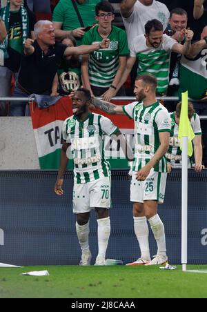 Ivan Petryak of MOL Fehervar FC dribbles between Franck Boli of