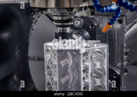 Metalworking CNC milling machine. Cutting metal modern processing technology. Small depth of field. Warning - authentic shooting in challenging condit Stock Photo