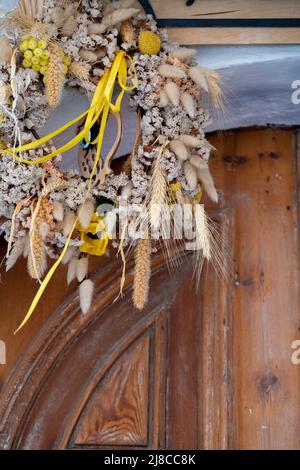 Easter decoration wreath hanging on a door. Stock Photo