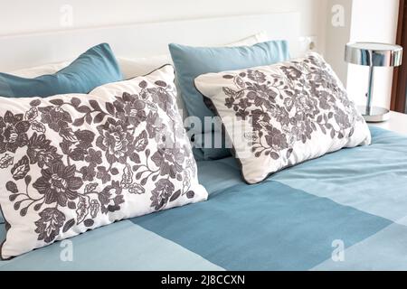 Close up of the comfortable pillows on the bed in a hotel room. Stock Photo