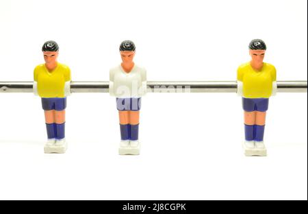 Plastic football player on metal pole used for table football Stock Photo