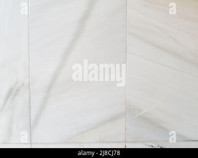Vertical White marble on a wall. Marble tiles textures Stock Photo