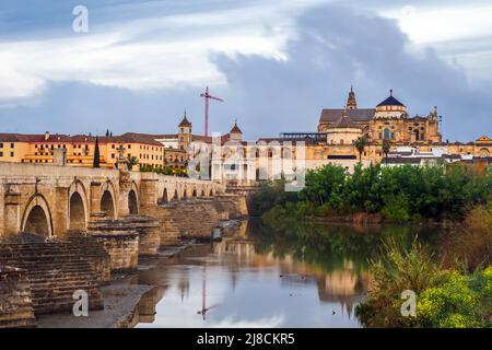 Roman Bridge on Guadalquivir river and the Great Mosque (Mezquita Cathedral) - Cordoba, Spain Stock Photo