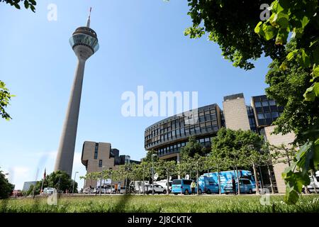 15 May 2022, North Rhine-Westphalia, Duesseldorf: Broadcast trucks parked in front of the North Rhine-Westphalia state parliament. The election for the 18th state parliament takes place in North Rhine-Westphalia on Sunday. Photo: Friso Gentsch/dpa Stock Photo