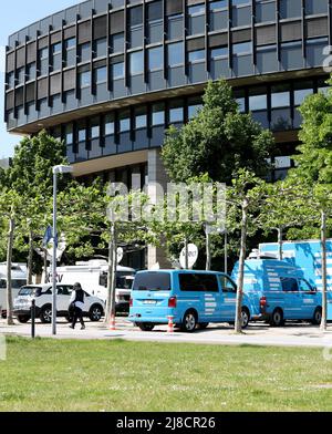 15 May 2022, North Rhine-Westphalia, Duesseldorf: Broadcast trucks parked in front of the North Rhine-Westphalia state parliament. The election for the 18th state parliament takes place in North Rhine-Westphalia on Sunday. Photo: Friso Gentsch/dpa Stock Photo