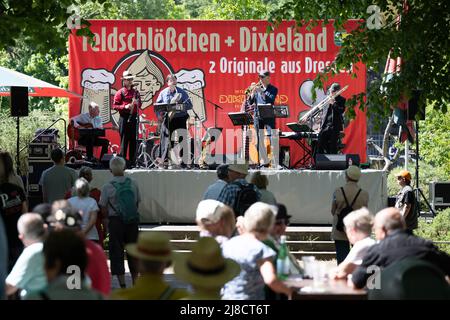 Dresden, Germany. 15 May 2022, Saxony, Dresden: Visitors sit in front of a stage at the opening of the 50th Dresden International Dixieland Festival at the zoo. The festival will feature 40 bands and soloists from May 15 to 22, 2022. Photo: Sebastian Kahnert/dpa Credit: dpa picture alliance/Alamy Live News