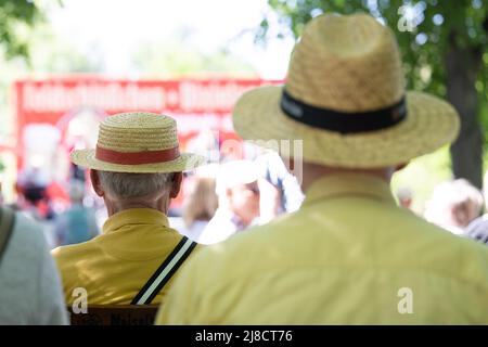 Dresden, Germany. 15 May 2022, Saxony, Dresden: Visitors sit in front of a stage at the opening of the 50th Dresden International Dixieland Festival at the zoo. The festival will feature 40 bands and soloists from May 15 to 22, 2022. Photo: Sebastian Kahnert/dpa Credit: dpa picture alliance/Alamy Live News