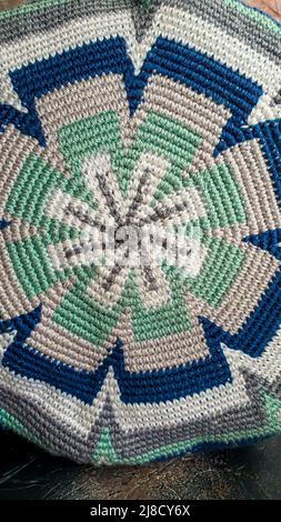Handmade bags. Knitted from colored threads. Volumetric and comfortable to wear with a long handle. Crochet and knitting. Stock Photo