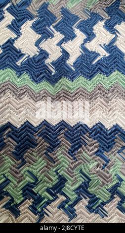 Handmade bags. Knitted from colored threads. Volumetric and comfortable to wear with a long handle. Crochet and knitting. Stock Photo