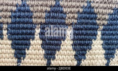 Handmade bags. Knitted from colored threads. Volumetric and comfortable to wear with a long handle. Crochet and knitting. Stock Photo