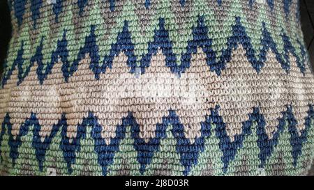 Handmade bags. Knitted from colored threads. Volumetric and comfortable to wear with a long handle. Crochet and knitting. Stock Photo
