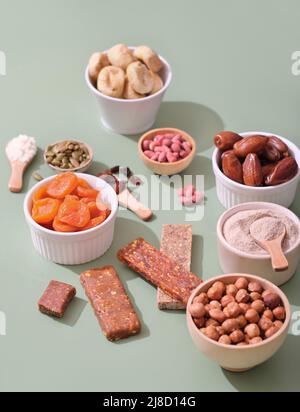 healthy snack, home made energy bars, superfood protein bars with ingredients, vertical. nuts and dry fruits and protein powder Stock Photo