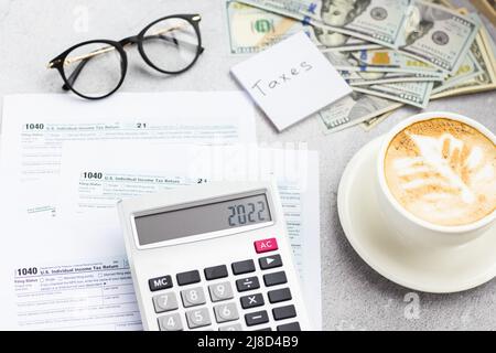 Flat lay of Individual income tax return form for tax payment on working desk. Background for Data analysis, paperwork, financial research, report Stock Photo