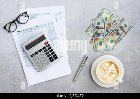 Flat lay of Individual income tax return form for tax payment on working desk. Background for Data analysis, paperwork, financial research, report Stock Photo