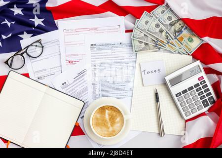 Flat lay of Individual income tax return form for tax payment on working desk. Background for Data analysis, paperwork, financial research, report Stock Photo